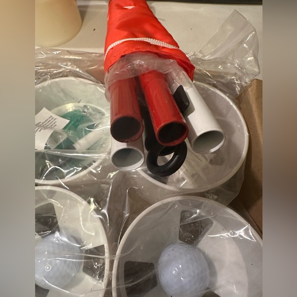 new PGA flag and cup set plus new sealed 4 cups with balls, marker and tees. - Picture 3 of 6